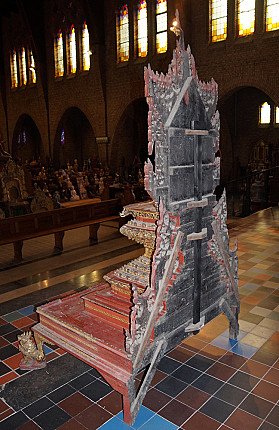 Rear view of the large Burmese wooden throne, showing the back construction and braces