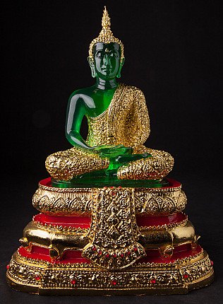 Thai Buddha statue seated in bhumisparsha mudra, green body with gold robe on red-gold base