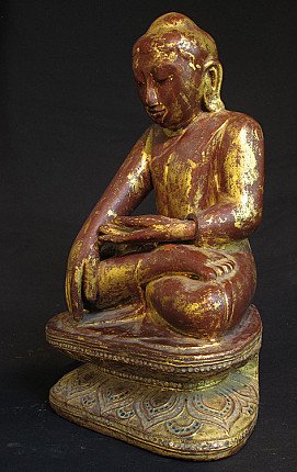 Wooden Buddha statue from Myanmar in Shan style, three-quarter left view with worn gilding