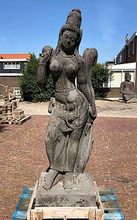 Large lavastone Tara statue from Indonesia, standing on base, full-front view