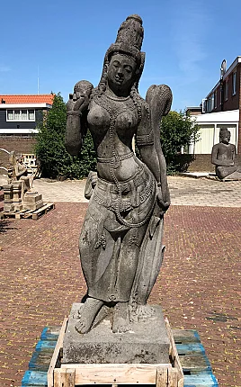 Large lavastone Tara statue from Indonesia, standing on base, full-front view