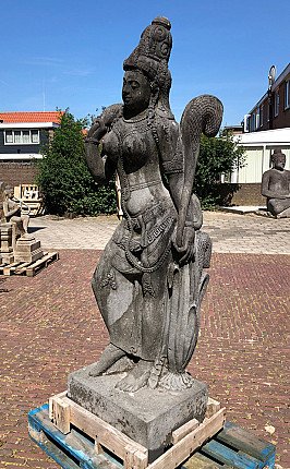 Lavastone Tara statue from Indonesia, standing three-quarter left view with tall headdress