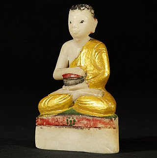 Burmese monk statue in marble with gilded robe, three-quarter right view