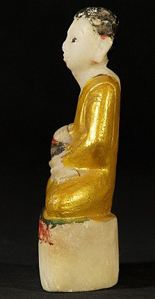 Burmese monk statue in marble, seated, left side profile