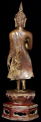 Thai Sukhothai Buddha statue in bronze, rear view showing robe drape and flame finial