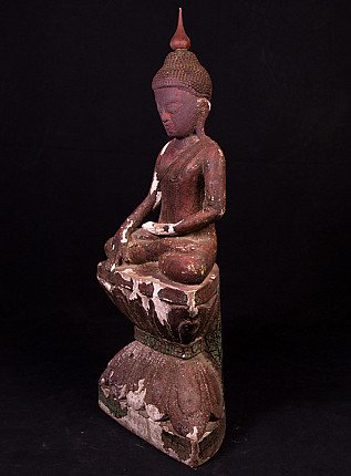 Buddha statue in wood from Myanmar, three-quarter left view showing hands and stepped base