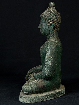 Thai bronze Buddha statue seated, left side profile with curled hair and ear