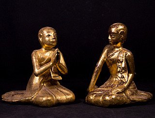 Pair of Burmese wooden monk statues, seated; one in namaskara mudra, angled front view