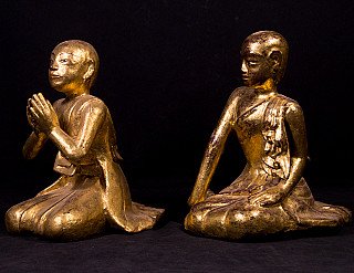 Set of Burmese wooden monk statues, three-quarter view; left praying hands, right turned slightly