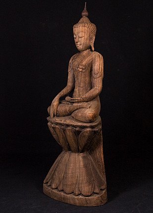 Old teak wooden Buddha statue