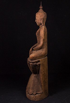 Old teak wooden Buddha statue
