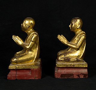 Pair of wooden monk statues from Burma (Myanmar), side profile with prayer hands