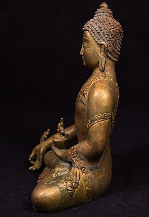 Nepalesische Medizin-Buddha-Statue aus Bronze, Seitenansicht mit Schale auf dem Knie