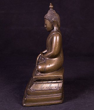 Bronze Ava Buddha statue from Burma (Myanmar), side profile view with stepped base