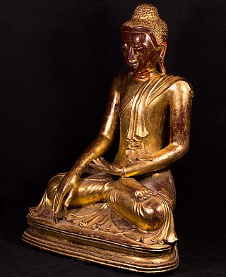 Mandalay Buddha statue from Burma in bronze, three-quarter left view on tiered base