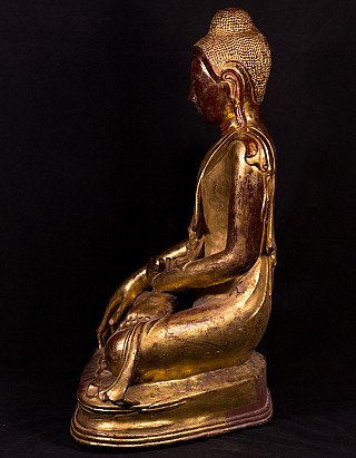 Burmese bronze Buddha statue seated in Mandalay style, right side profile view