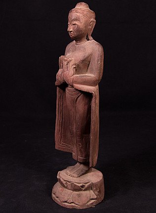 Buddha statue in wood from Burma (Myanmar), three-quarter left view with dharmachakra mudra