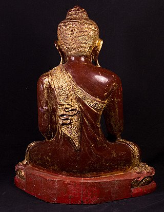 Wooden Buddha statue from Myanmar, rear view showing the gilded robe band across the back