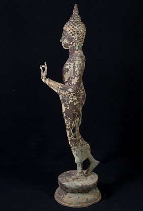 Antique standing Thai Buddha statue