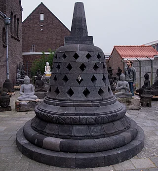 Large Indonesian lavastone stupa, full view with perforated dome and circular base