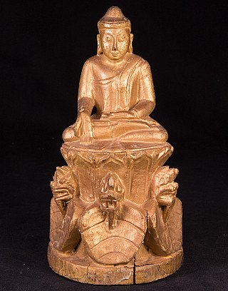 Wooden Buddha statue from Burma, seated with varada mudra, full front view on carved base