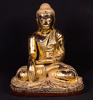 Burmese Mandalay Buddha statue in wood, seated in bhumisparsha mudra, full front view