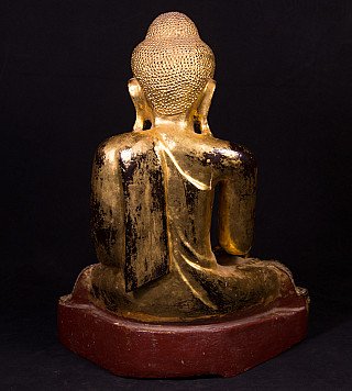 Wooden Buddha statue from Burma (Myanmar), rear view with draped robe and red base