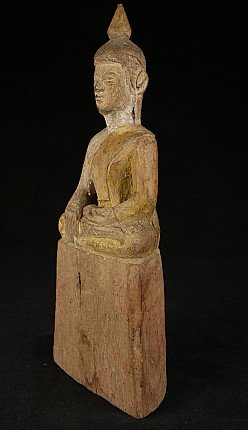 Wooden Buddha statue from Thailand, three-quarter left view with traces of gilding on the robe