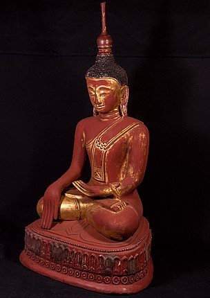 Ava Buddha statue from Myanmar in red lacquer with gilt details, three-quarter left view