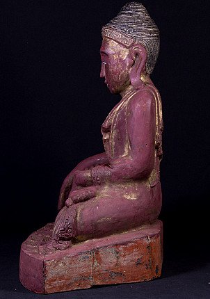 Burmese wooden Buddha statue seated, left side profile view