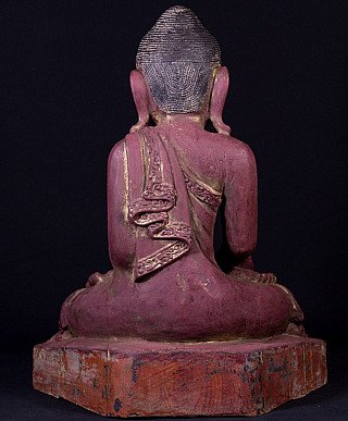 Burmese wooden Buddha statue seated, rear view showing robe drape and textured hair