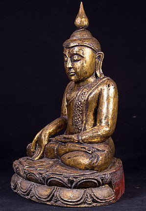 Buddha statue in wood from Burma (Myanmar), three-quarter left view on lotus base