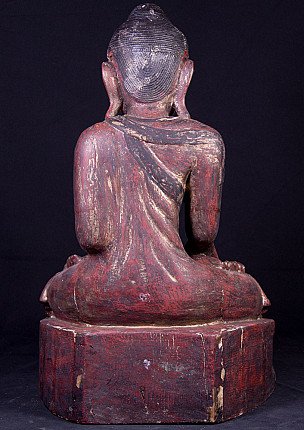 Wooden Buddha statue from Burma, rear view showing the robe folds and elongated ears