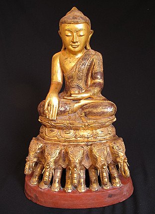Burmese wooden Buddha statue on elephant throne, full front view, seated in bhumisparsha mudra
