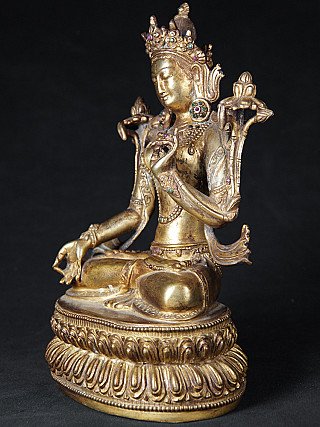 White Tara bronze statue from Nepal, three-quarter left view on lotus base
