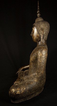 Antique Thai bronze Buddha statue seated, left side profile