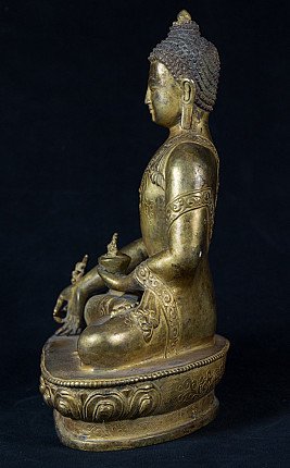 Nepalesische Medizinbuddha-Statue aus Bronze, sitzend in Seitenansicht mit Schale