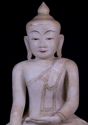 Marble Buddha statue from Myanmar, upper-body close-up showing incised robe lines