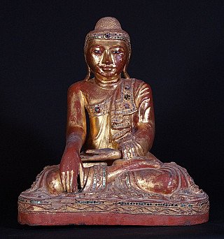 Burmese Mandalay Buddha statue in wood, seated in bhumisparsha mudra, full front view