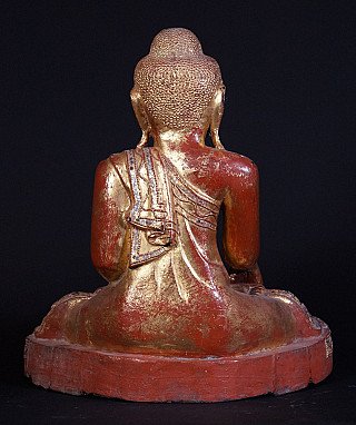 Seated Burmese Mandalay Buddha statue in wood, rear view with draped robe and gilding