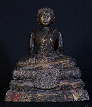 Thai bronze monk statue seated on an ornate base, full front view with worn gilding