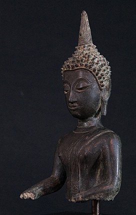 Bronze Buddha head statue from Thailand, angled front-left view with closed eyes