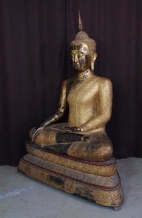Bronze Thai Buddha statue seated on a tiered base, three-quarter left view