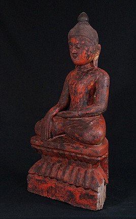 Wooden Ava Buddha statue from Burma, three-quarter left view with stepped base