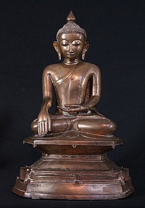 Burmese bronze Buddha statue in bhumisparsha mudra, full front view on stepped base