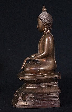 Burmese bronze Buddha statue seated, left side profile view