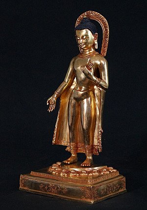 Nepali bronze Buddha statue with halo, three-quarter left view