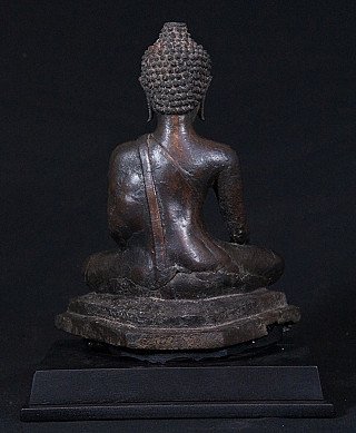 Thai bronze Buddha statue, rear view showing robe strap across the back and base