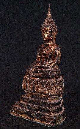 Bronze Buddha statue from Thailand, seated, three-quarter view showing tall ushnisha