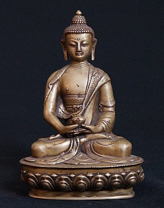 Bronze Buddha statue from India seated in dhyana mudra on a lotus base, full front view